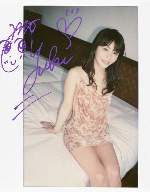 woman in patterned dress on bed