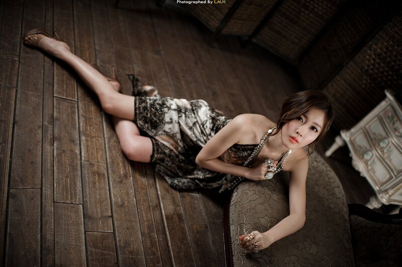 woman in patterned dress on floor