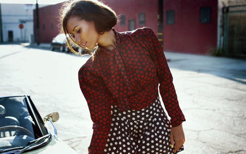 woman in patterned dress on street
