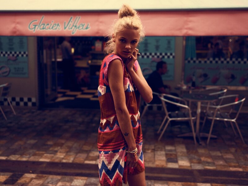 Woman in patterned dress on street