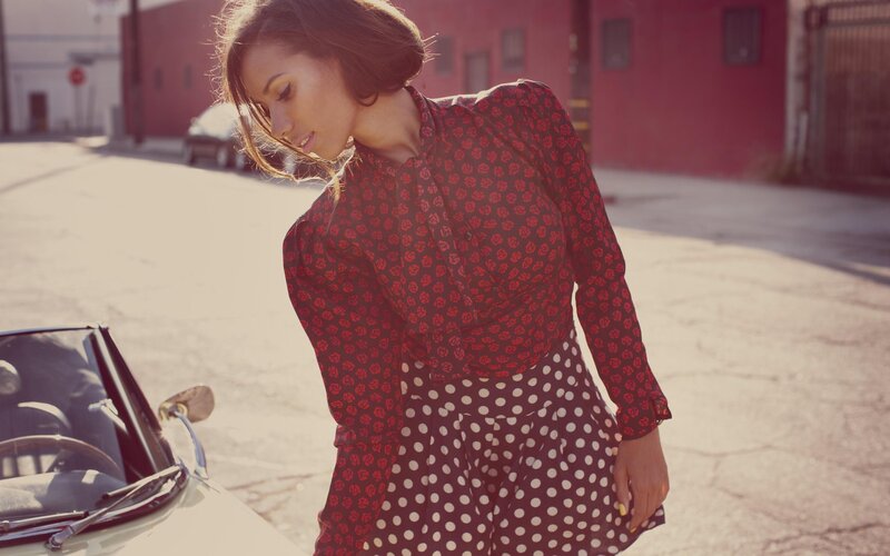 woman in patterned dress on street