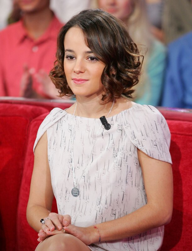 woman in patterned dress on talk show