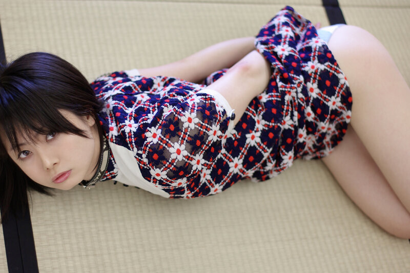 woman in patterned dress on tatami