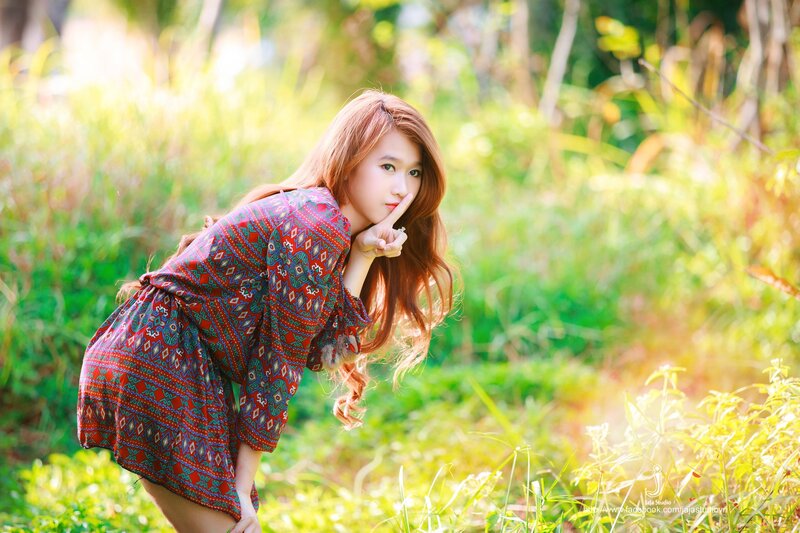 woman in patterned dress outdoors