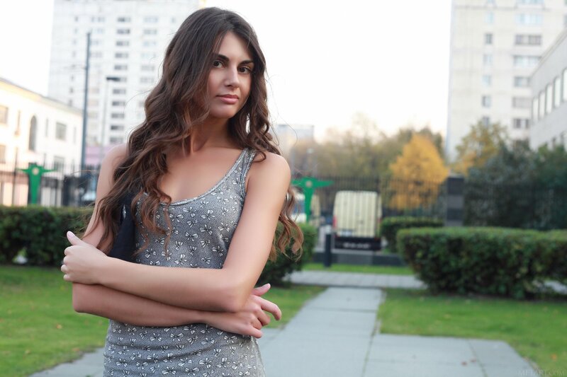 woman in patterned dress outdoors