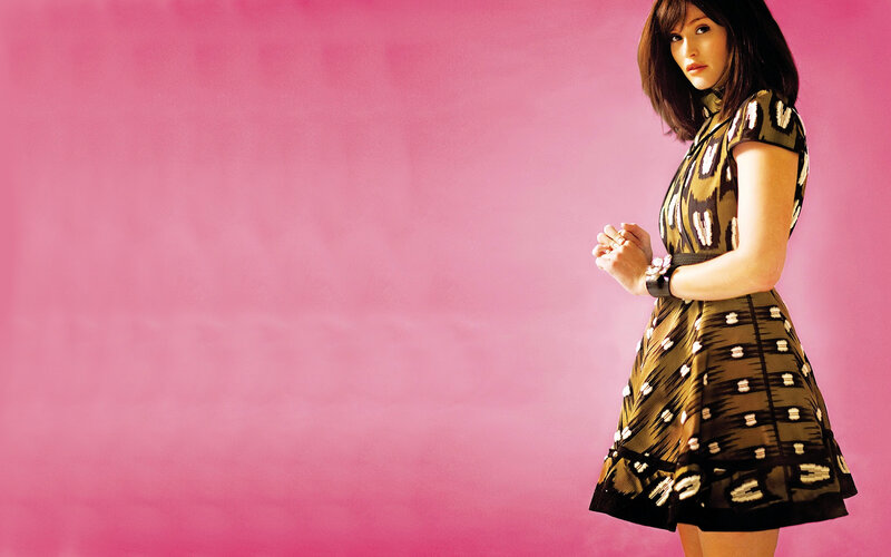 Woman in Patterned Dress — Pink, Confident, Photograph, Pink Background