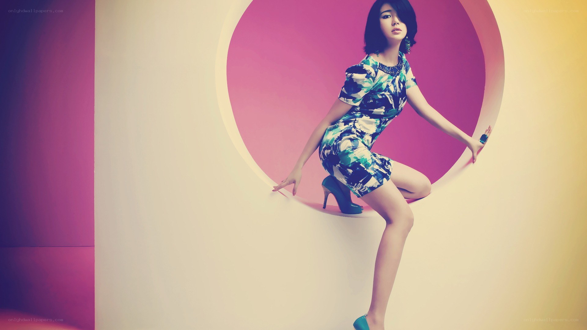 woman in patterned dress posing