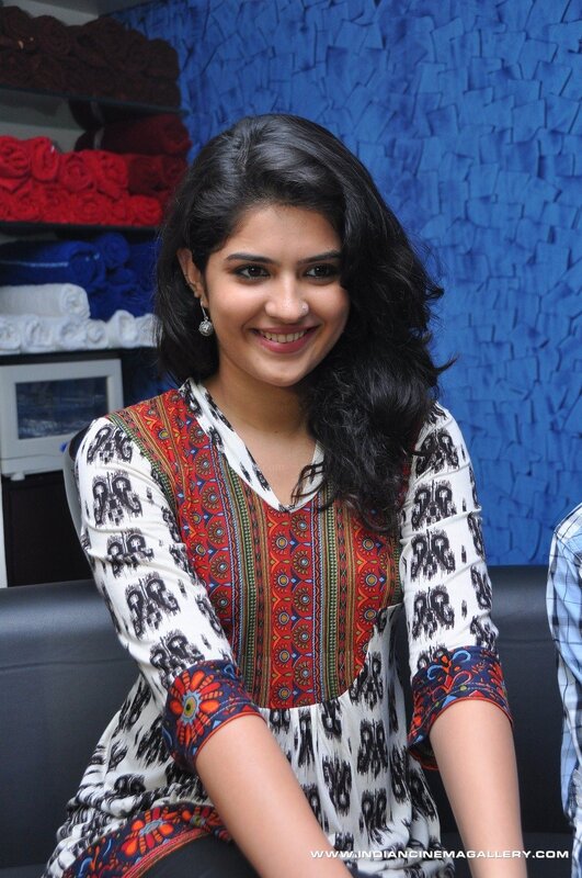 woman in patterned dress smiling
