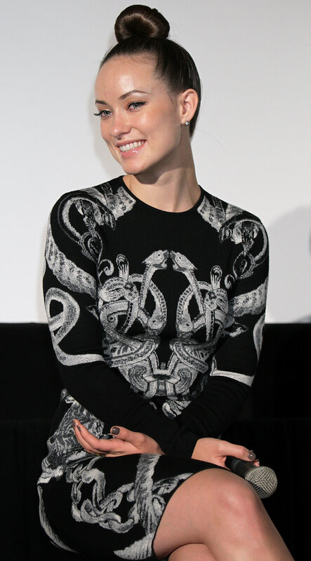 woman in patterned dress smiling