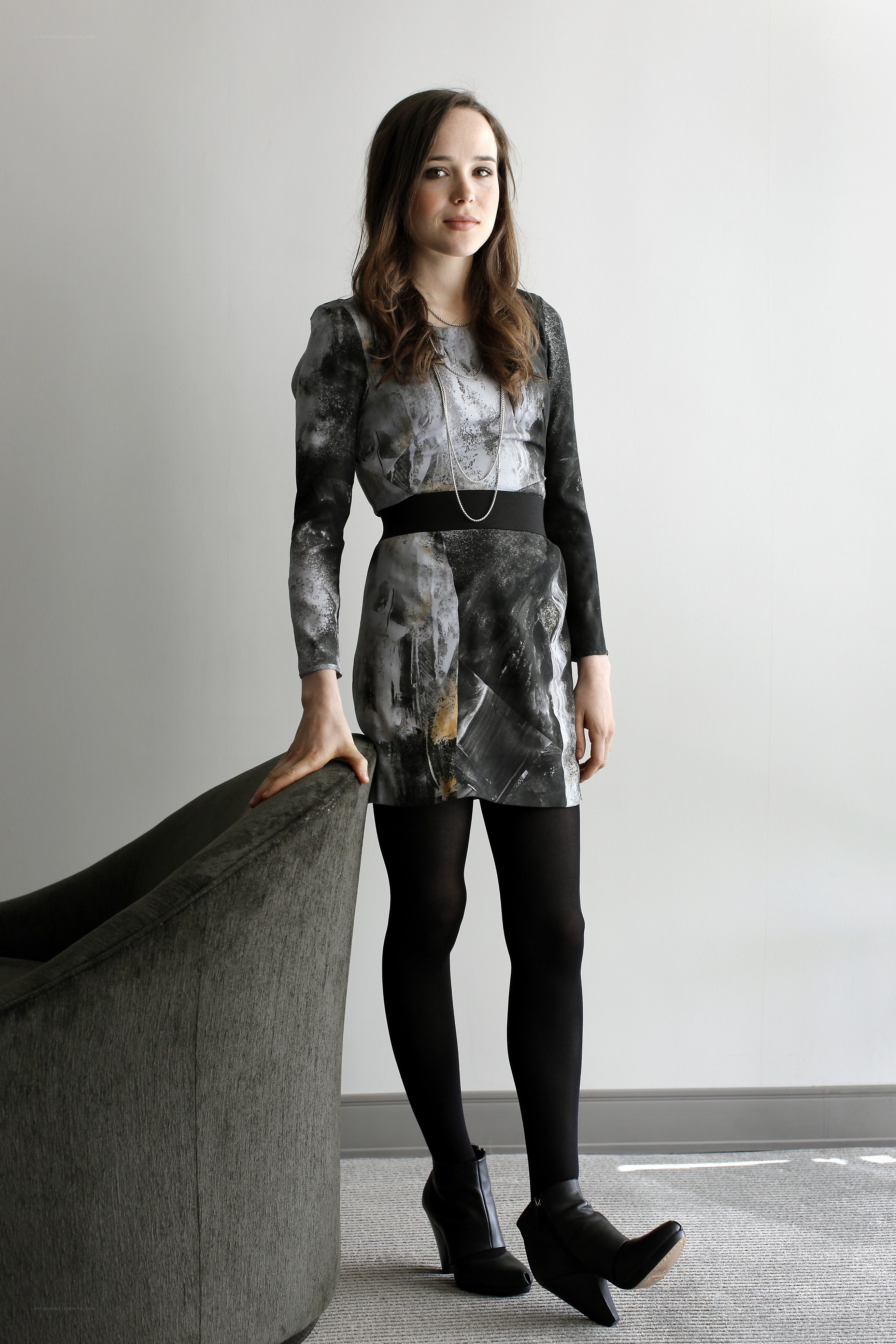woman in patterned dress standing