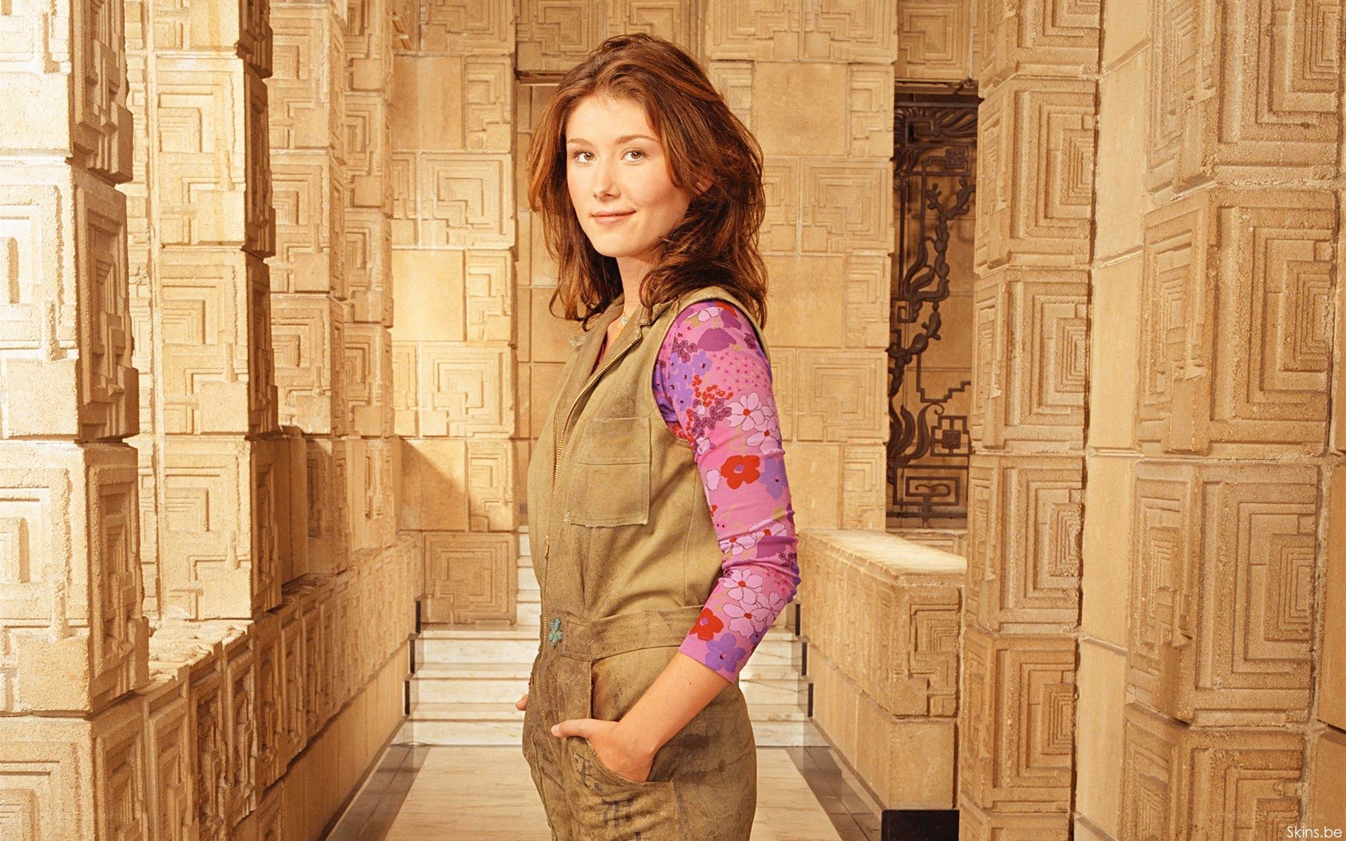 woman in patterned hallway