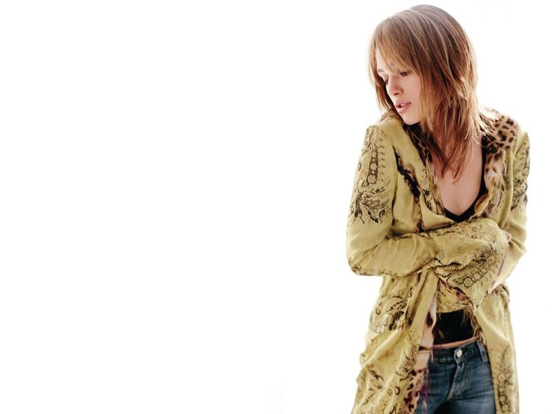 Woman in Patterned Jacket — Green, Neutral, Photograph, Jeans