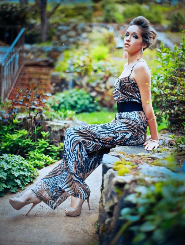 Woman in patterned jumpsuit outdoors