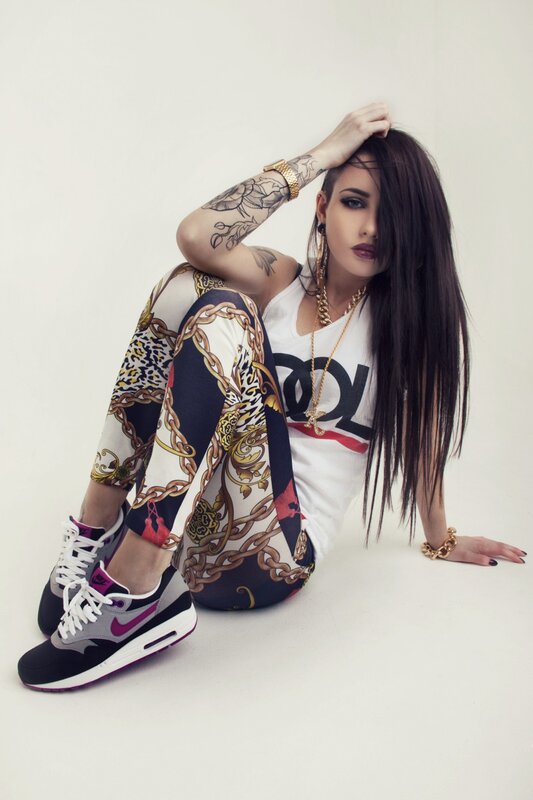 woman in patterned leggings and sneakers