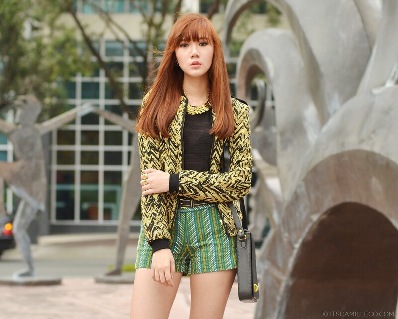 Woman in Patterned Outfit — Green, Confident