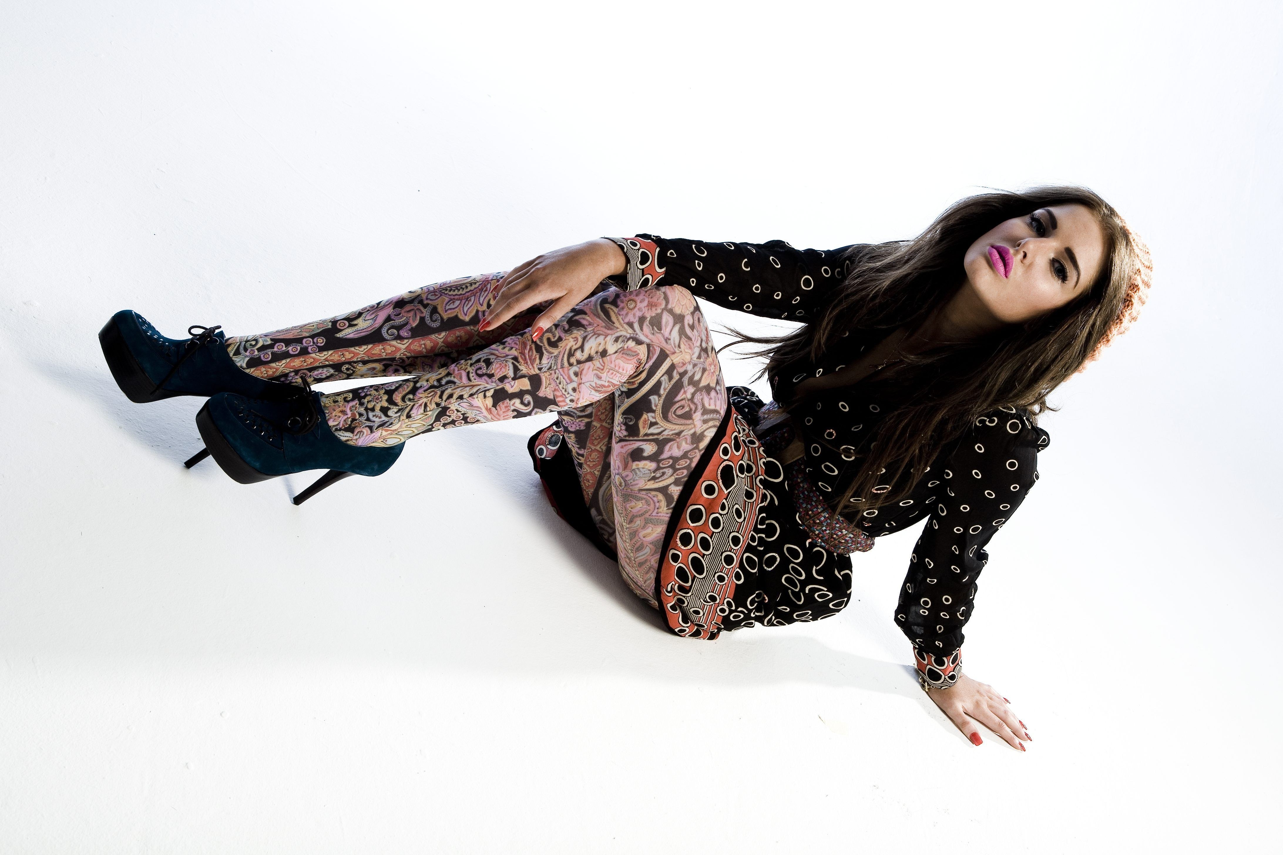 woman in patterned outfit posing