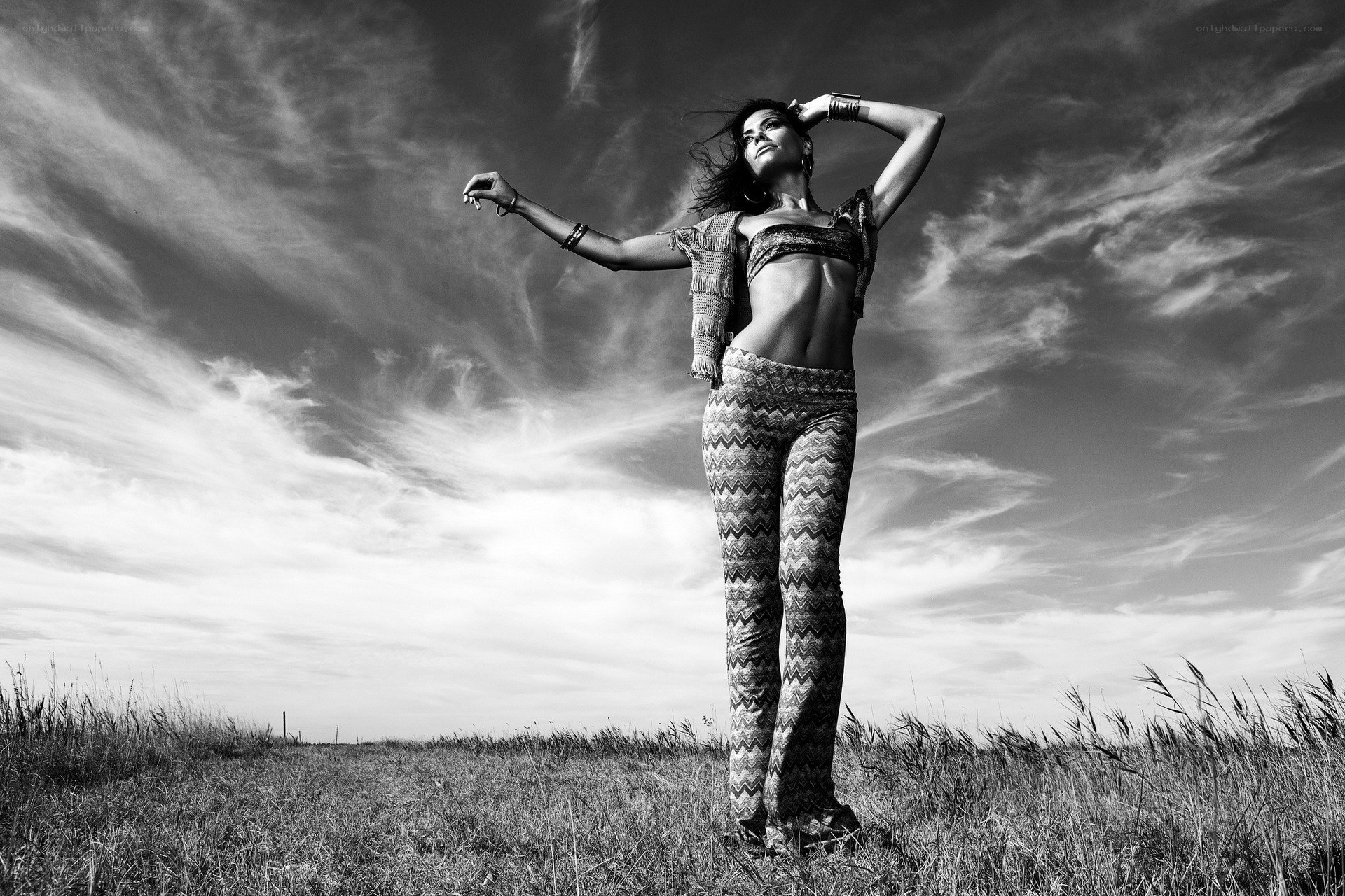 woman in patterned pants standing