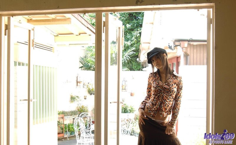 woman in patterned shirt at doorway