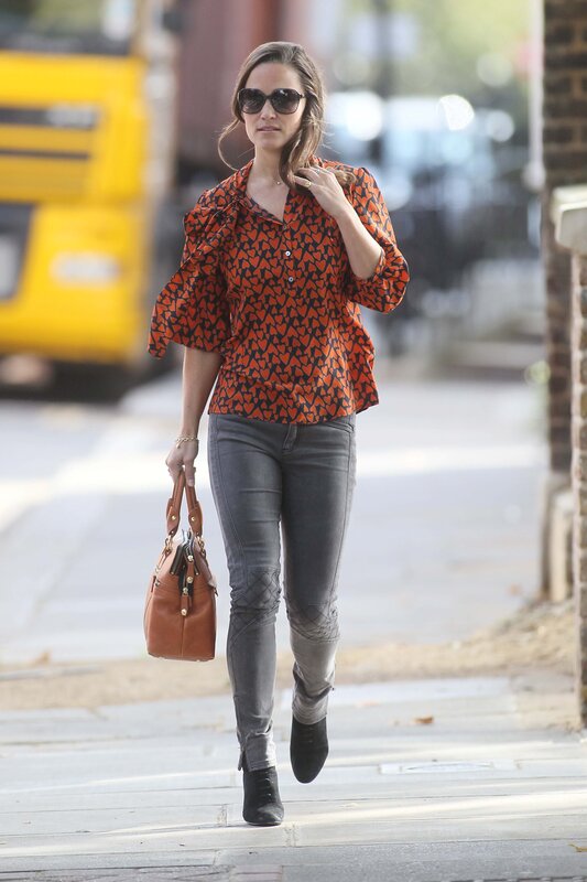 Woman in patterned shirt walking