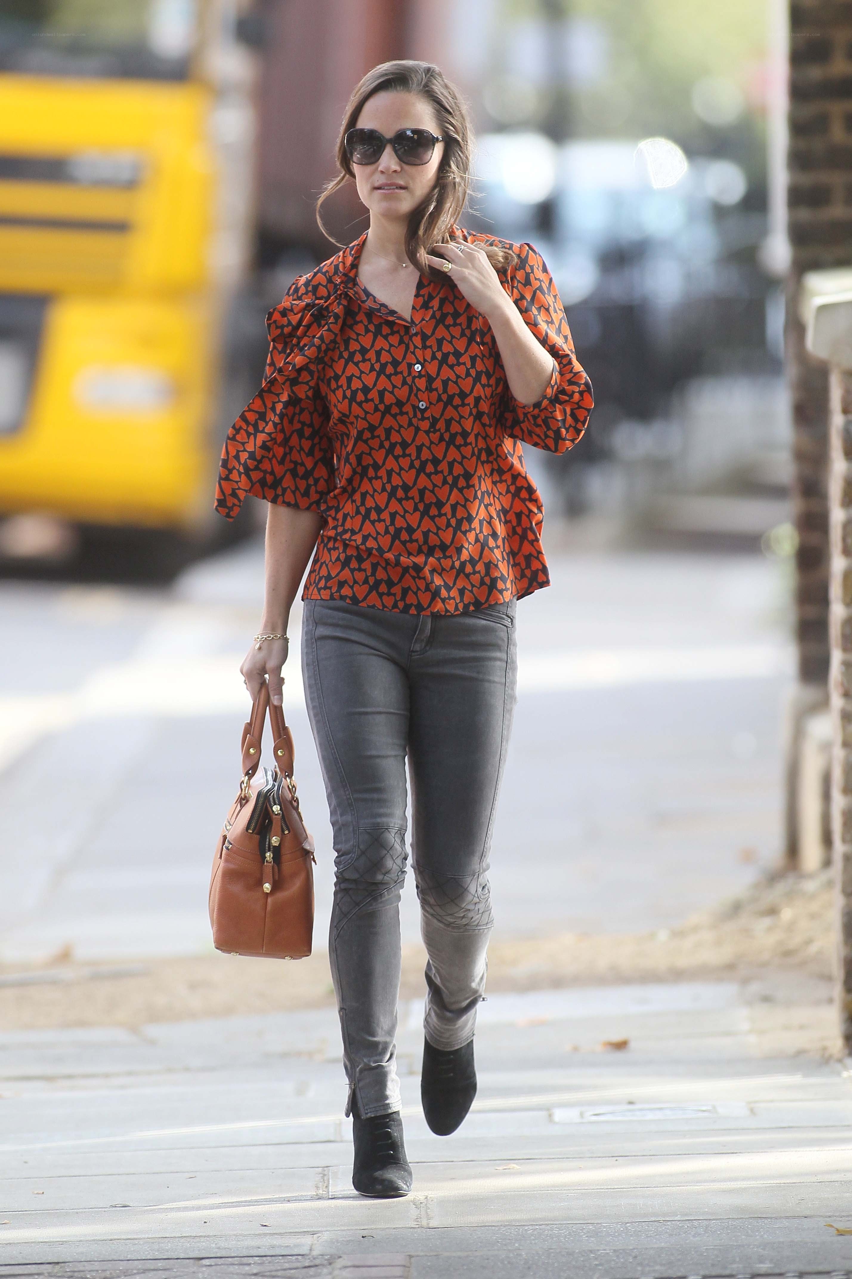 Woman in patterned shirt walking