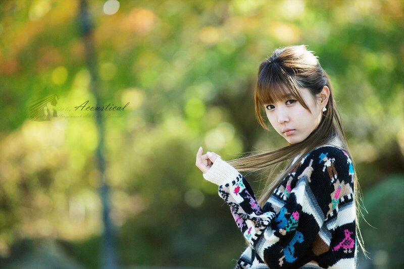 woman in patterned sweater outdoors