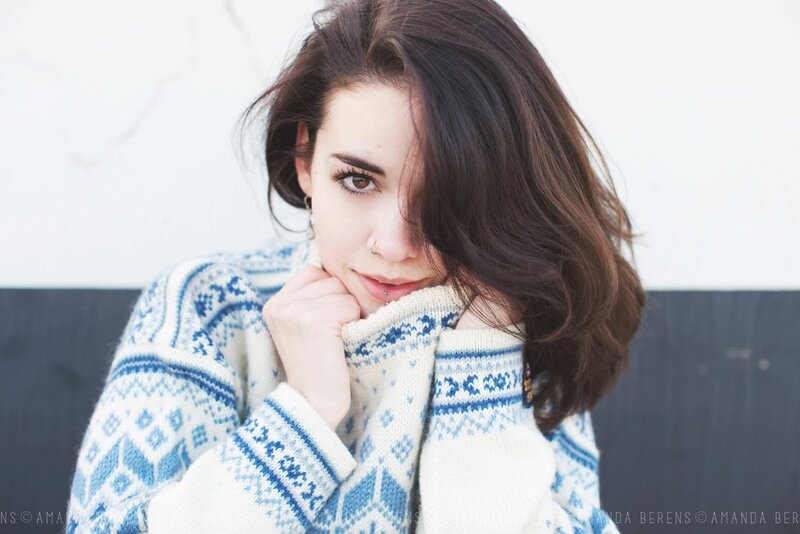 Woman in Patterned Sweater — White, Contemplative
