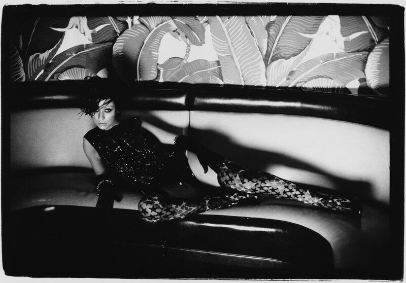 woman in patterned tights on couch