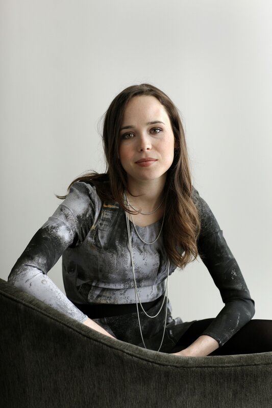 woman in patterned top sitting