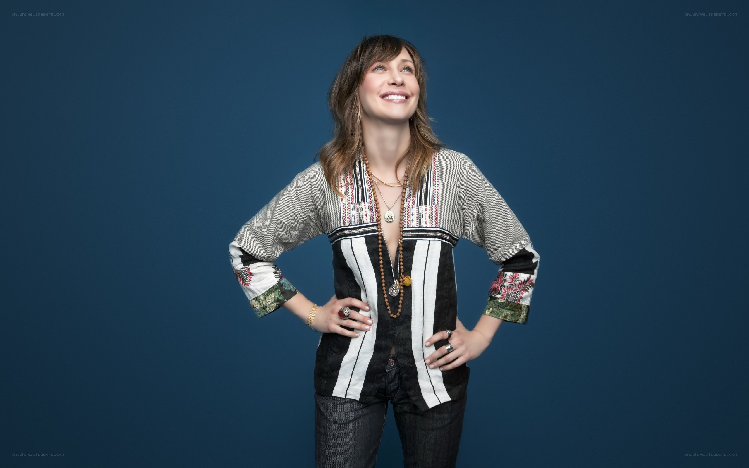 woman in patterned top smiling
