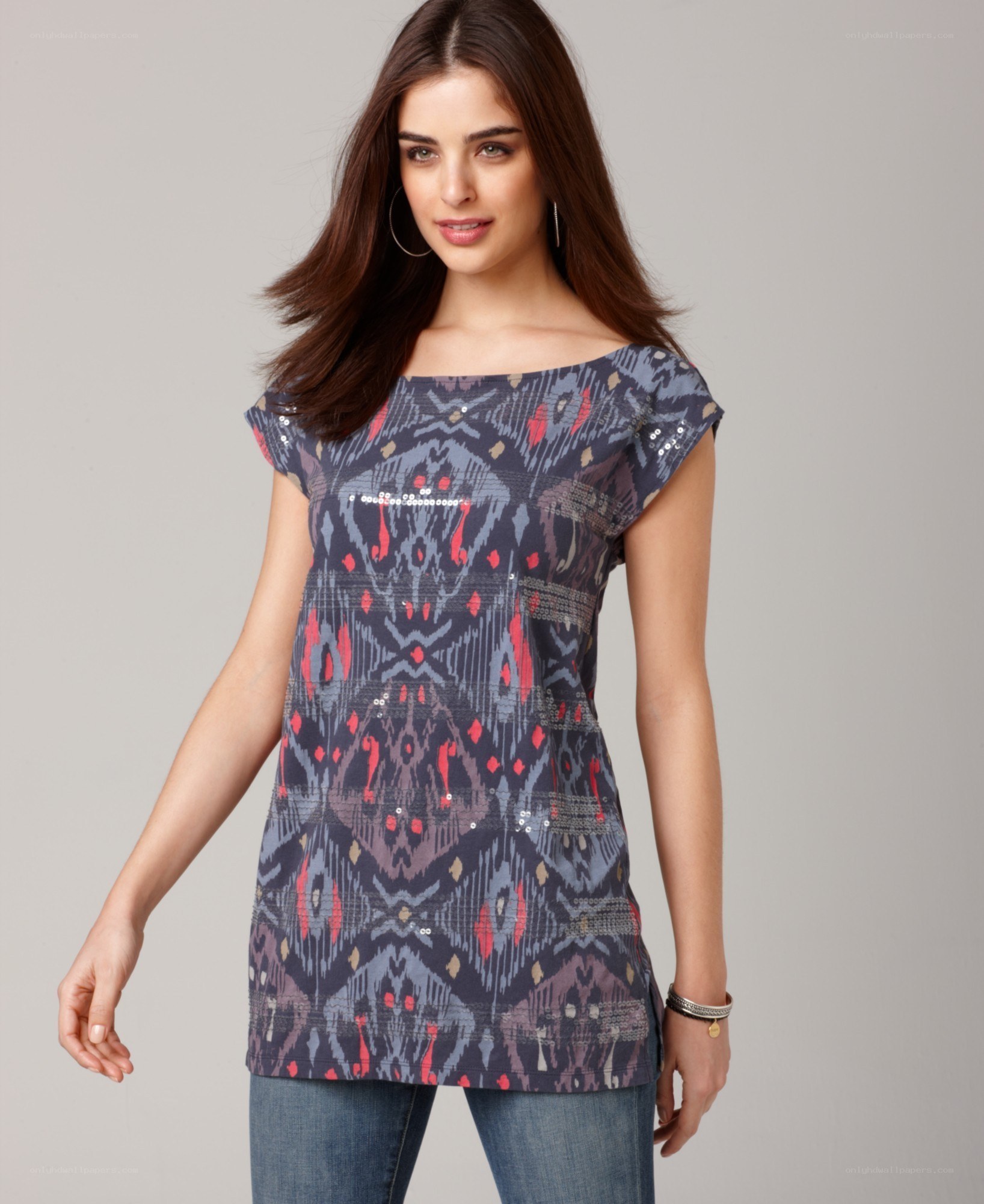 woman in patterned tunic