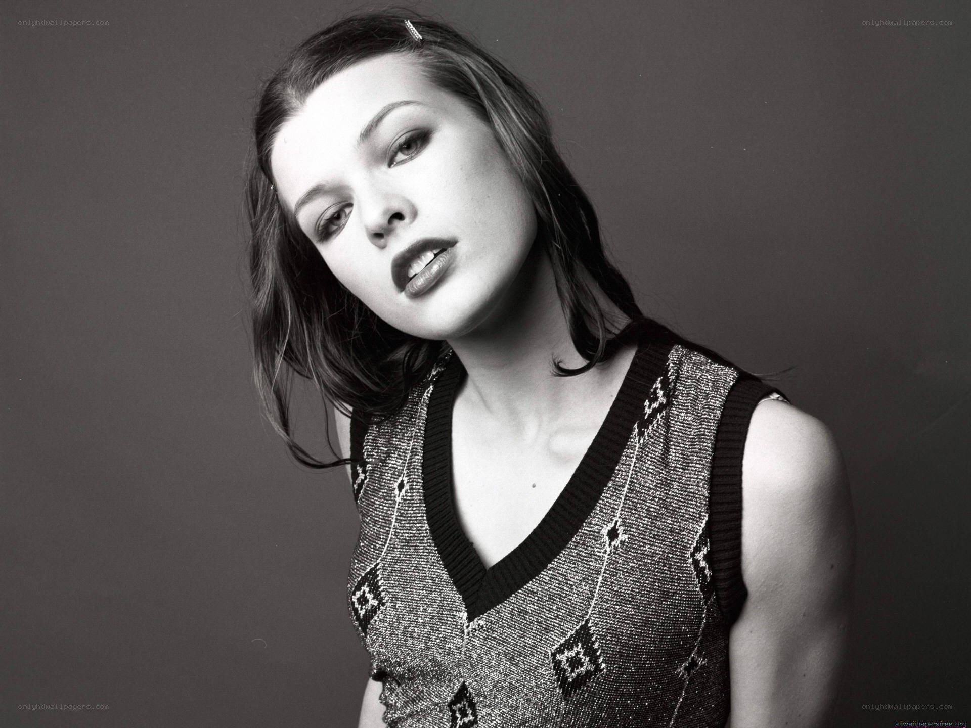 woman in patterned vest