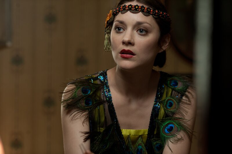 woman in peacock feather dress