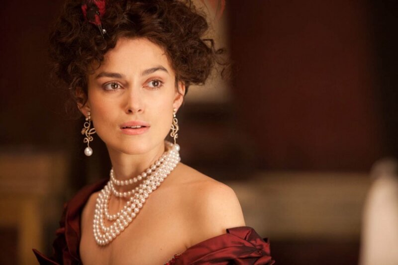 Woman in Pearl Necklace — Maroon