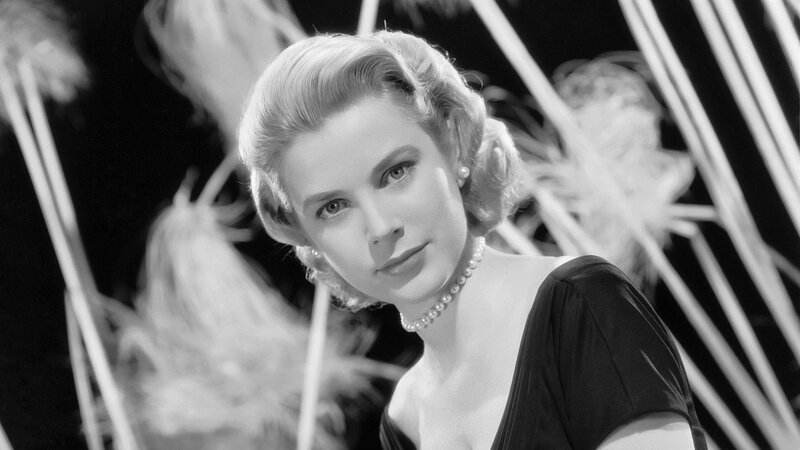 woman in pearls and black dress
