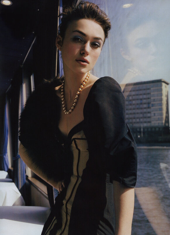 woman in pearls and black dress