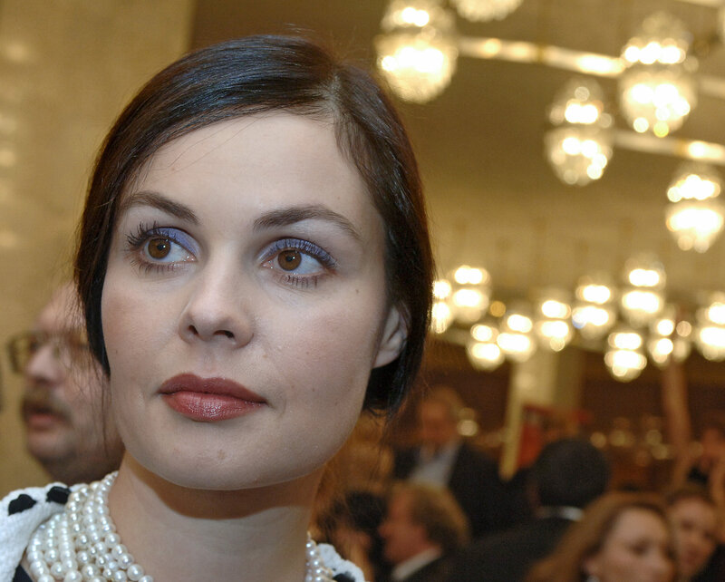 woman in pearls at event