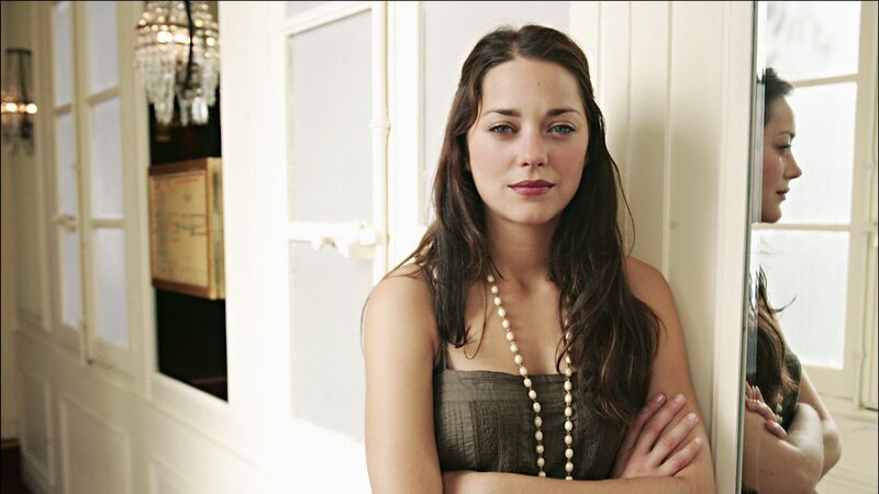 woman in pearls by mirror