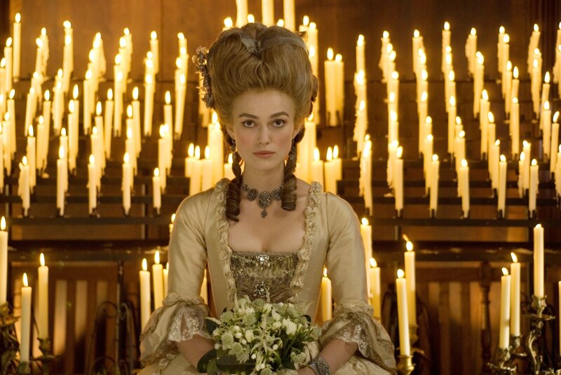 Woman in period dress with candles