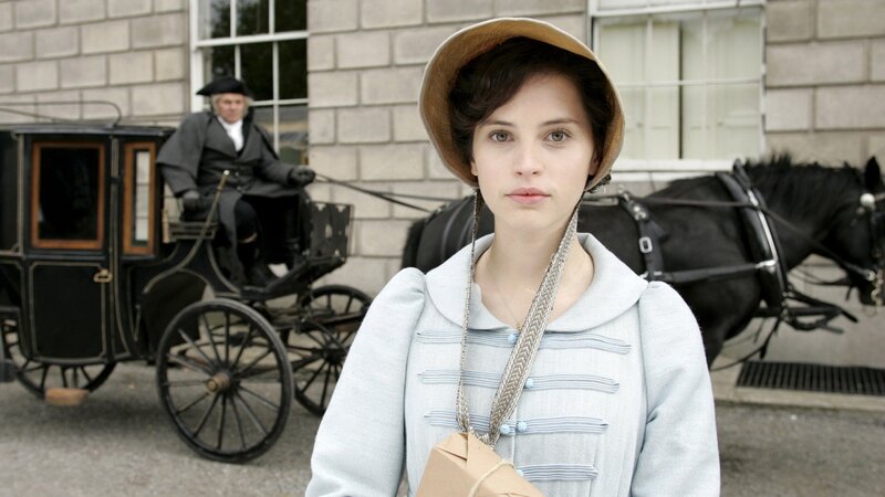 Woman in period dress with carriage