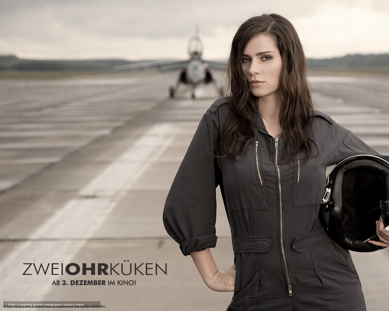 woman in pilot suit on tarmac