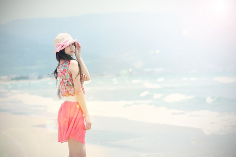 Woman in pink at the beach