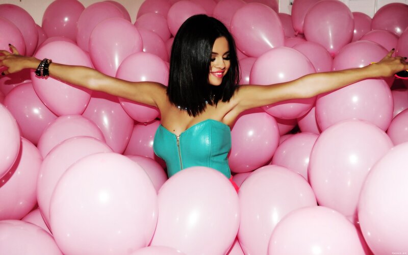 woman in pink balloon pit