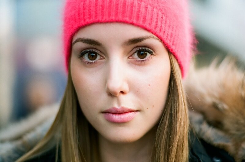 woman in pink beanie