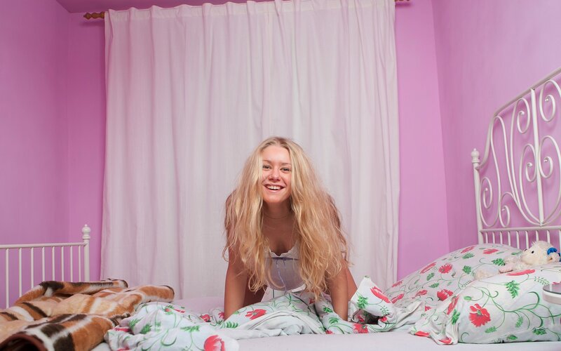 woman in pink bedroom
