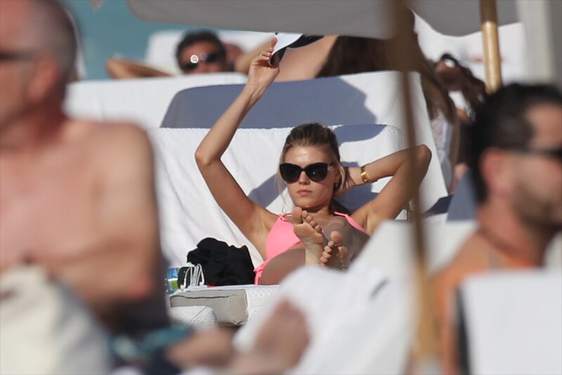 Woman in pink bikini at beach