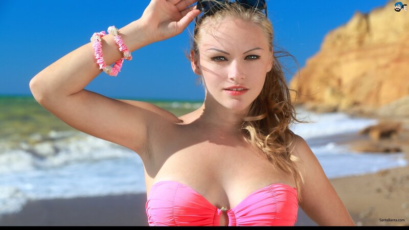 Woman in pink bikini at beach