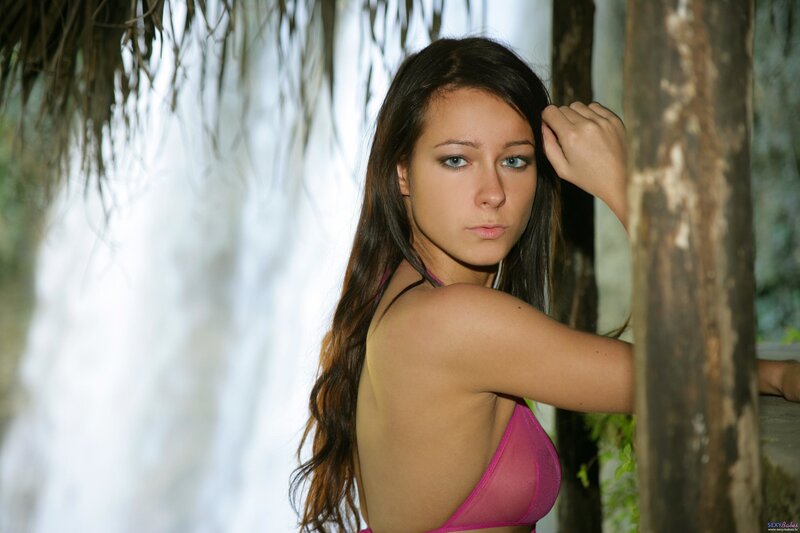 woman in pink bikini at waterfall