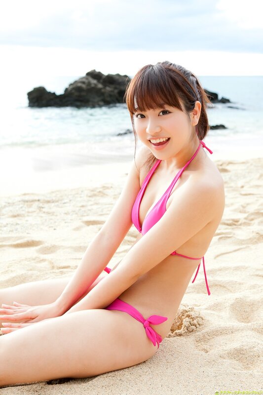 Woman in pink bikini on beach