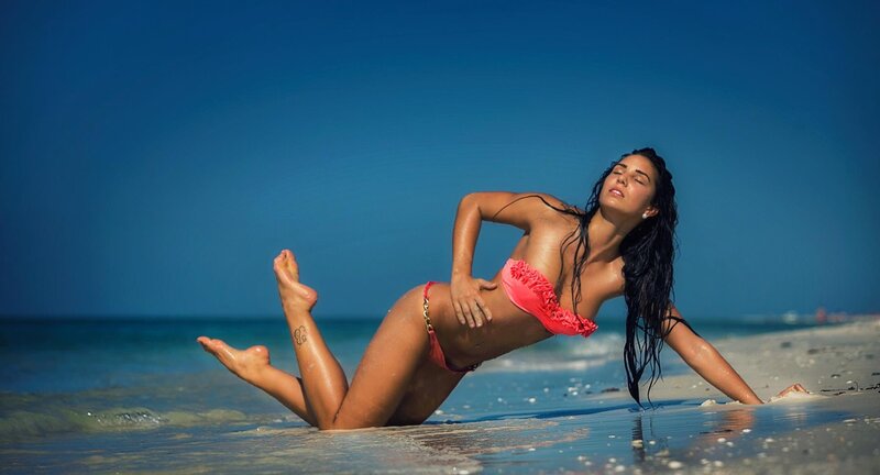 Woman in pink bikini on beach
