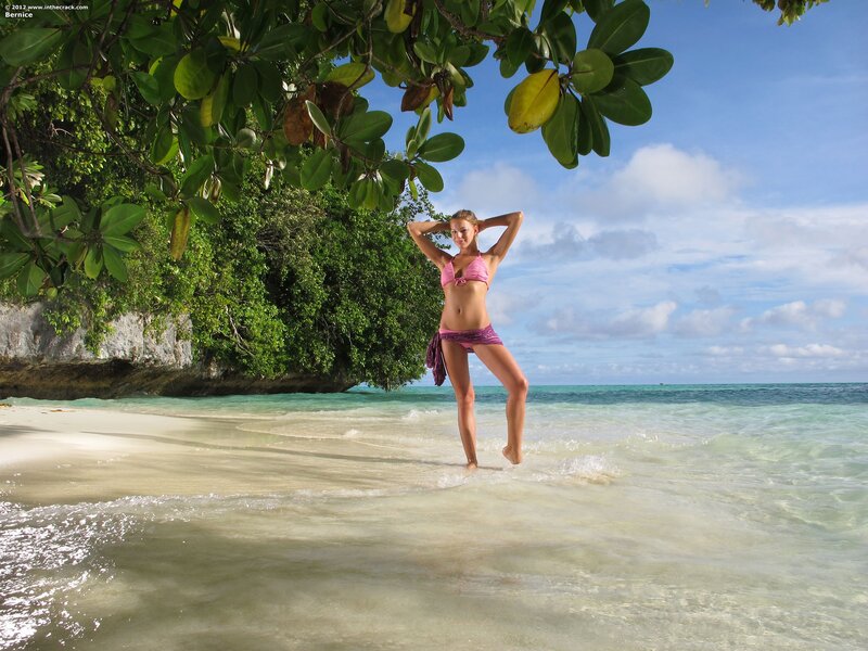 Woman in pink bikini on tropical beach
